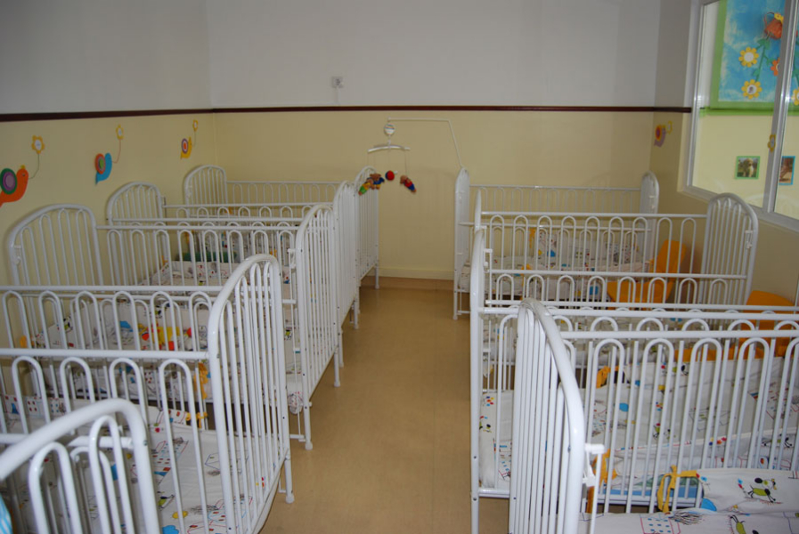 Infant cots in a nursery room at Jardim de infância de Santar preschool.