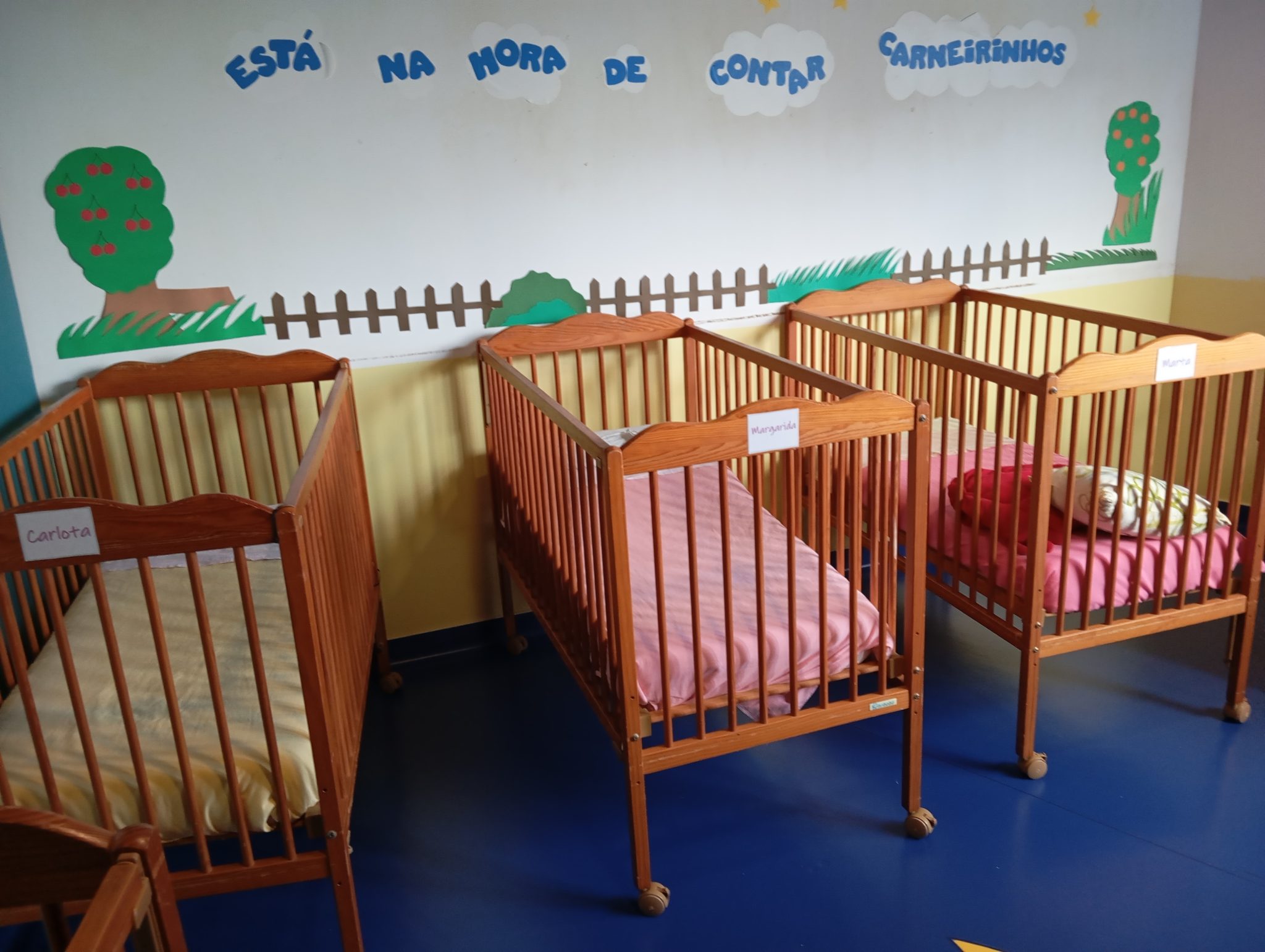 Wooden cribs in a preschool classroom