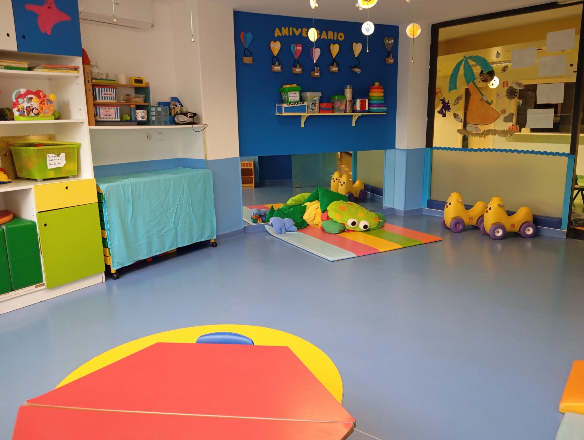 Preschool classroom with colorful toys and play area