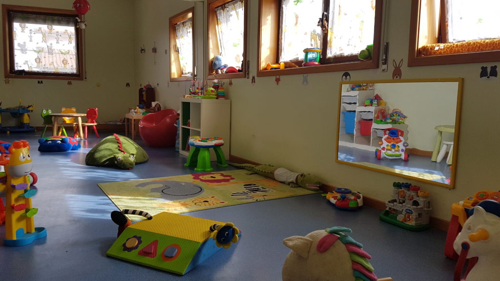 Preschool classroom with colorful toys and play area