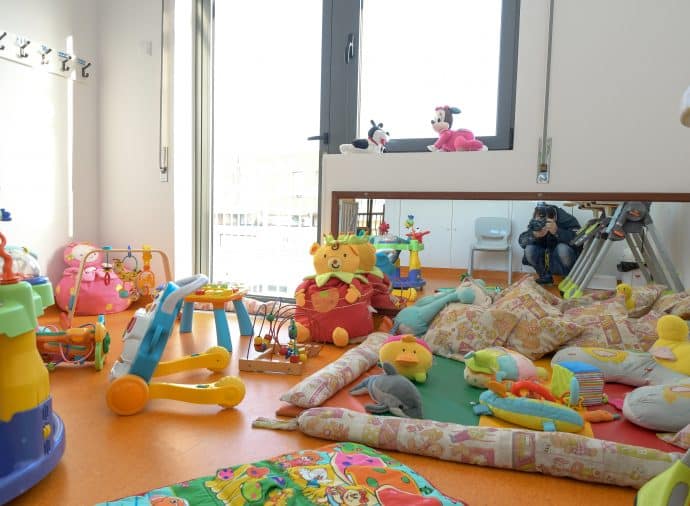 Preschool classroom with colorful toys and play equipment