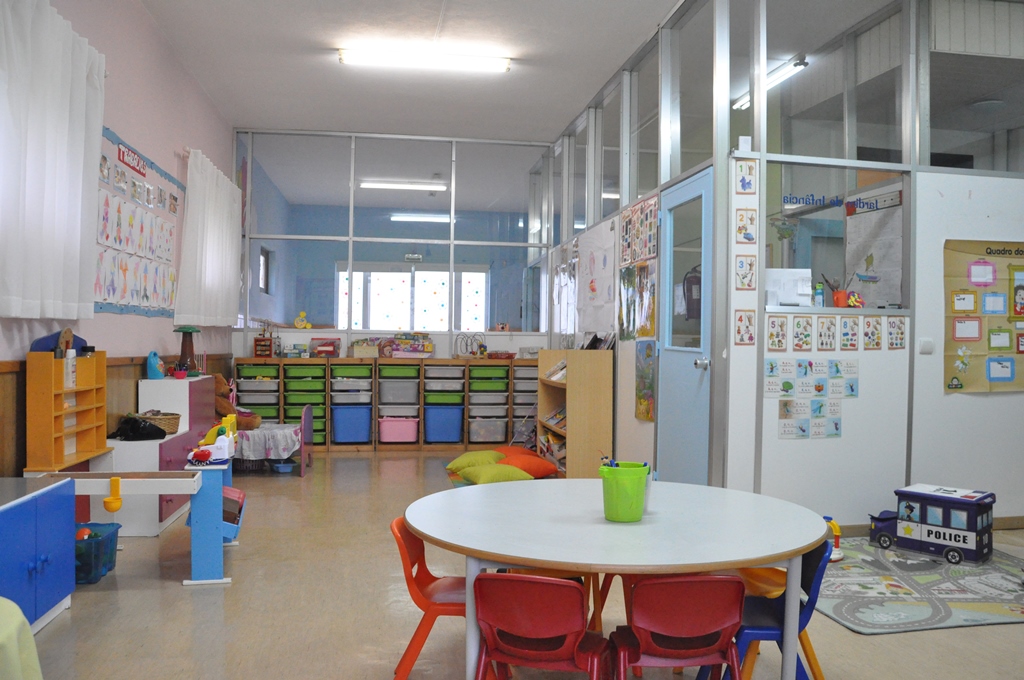 Preschool classroom with colorful furniture and educational materials