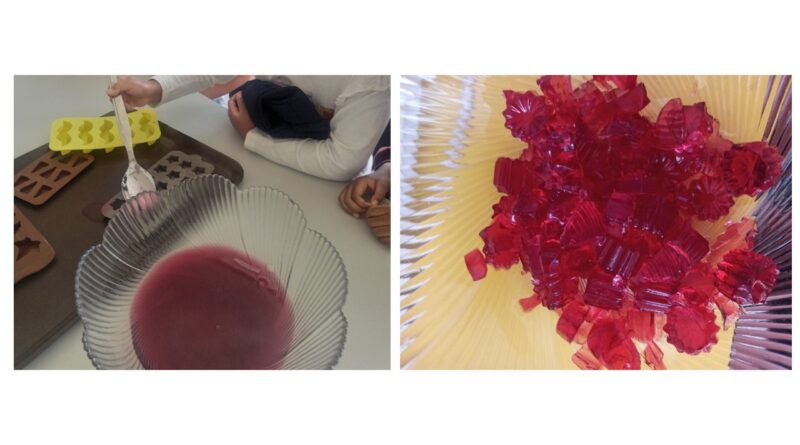 Preschool children making red jelly in molds