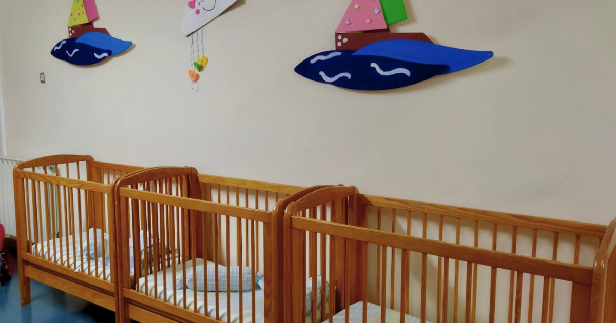 Wooden cribs in a nursery at CIVAS preschool