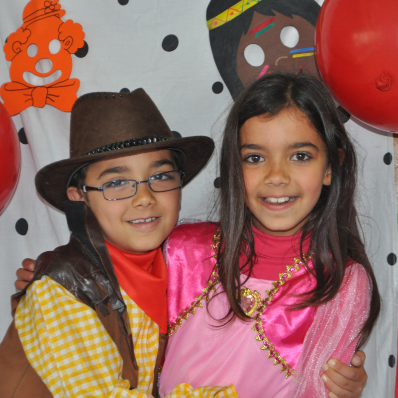 Two children dressed in costumes at Externato Sol Nascente