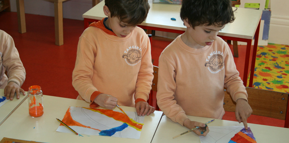 Preschool children painting in art class