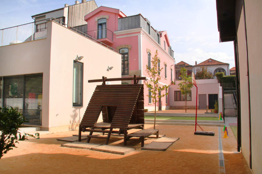 School Santa Maria playground with wooden play structure