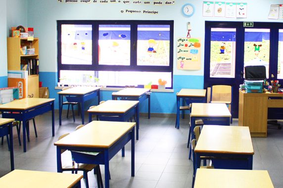 Preschool classroom with small tables and chairs