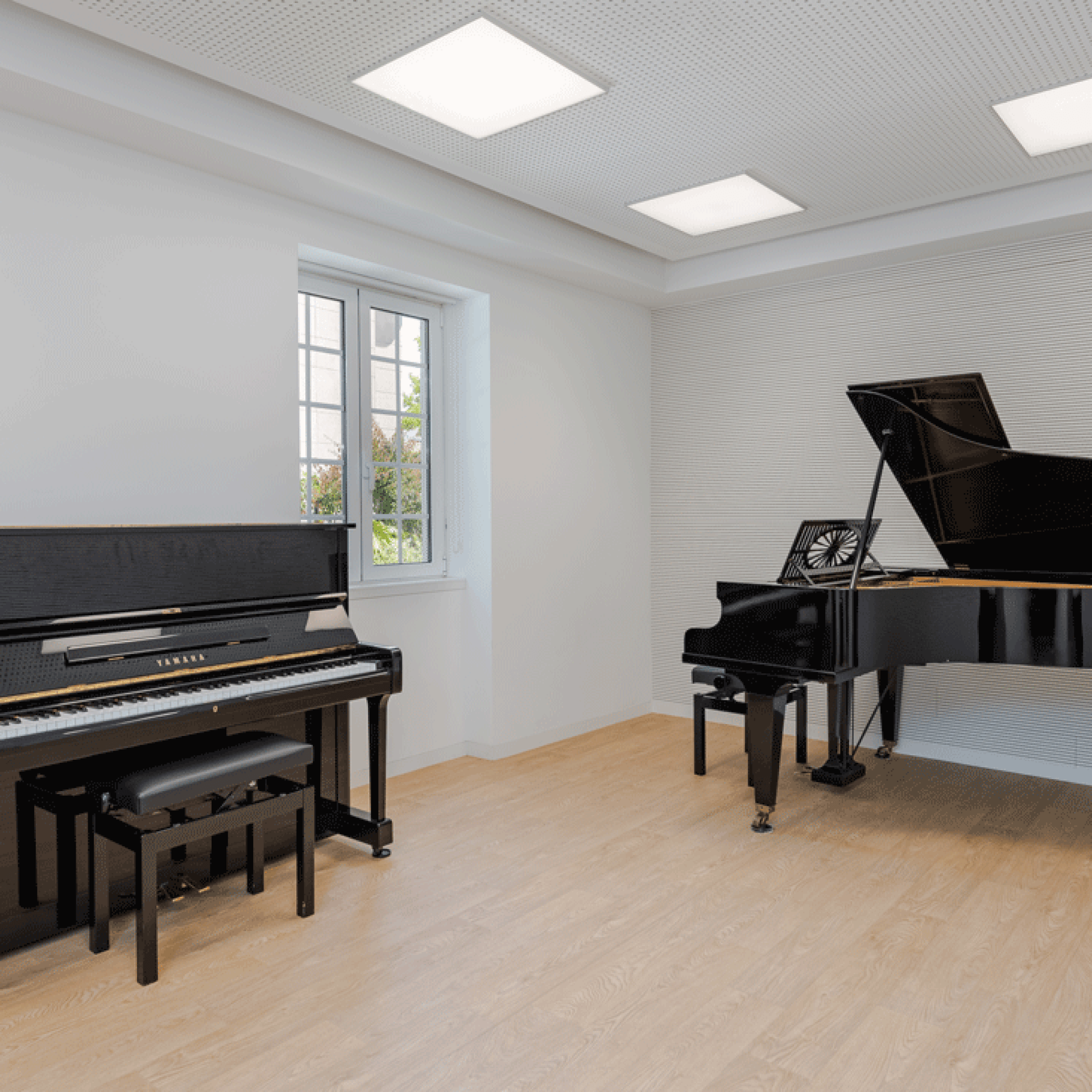 Two pianos in a music room at Colégio Moderno