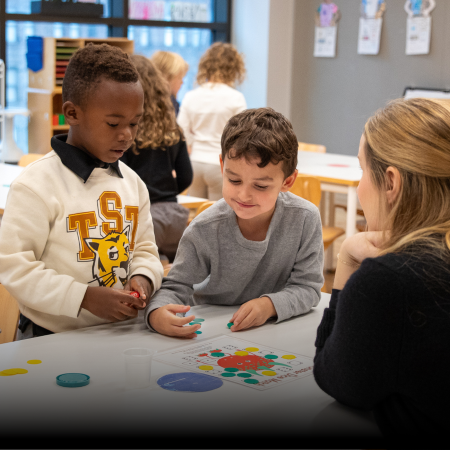 Preschool children engaged in a learning activity with a teacher