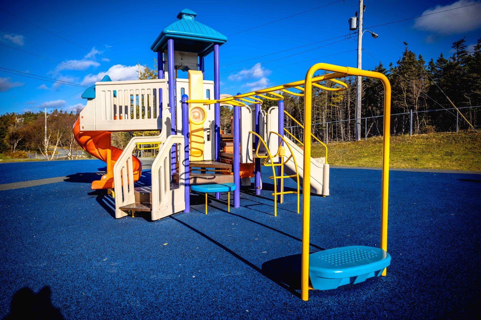 Colorful playground equipment on a blue surface