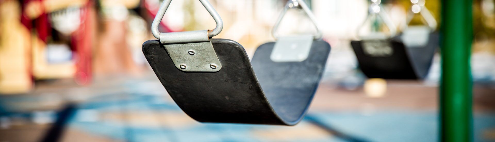 Empty swing set at preschool playground