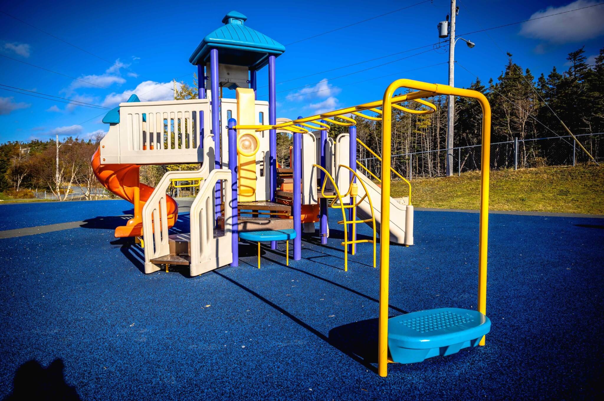 Colorful playground equipment on a blue surface