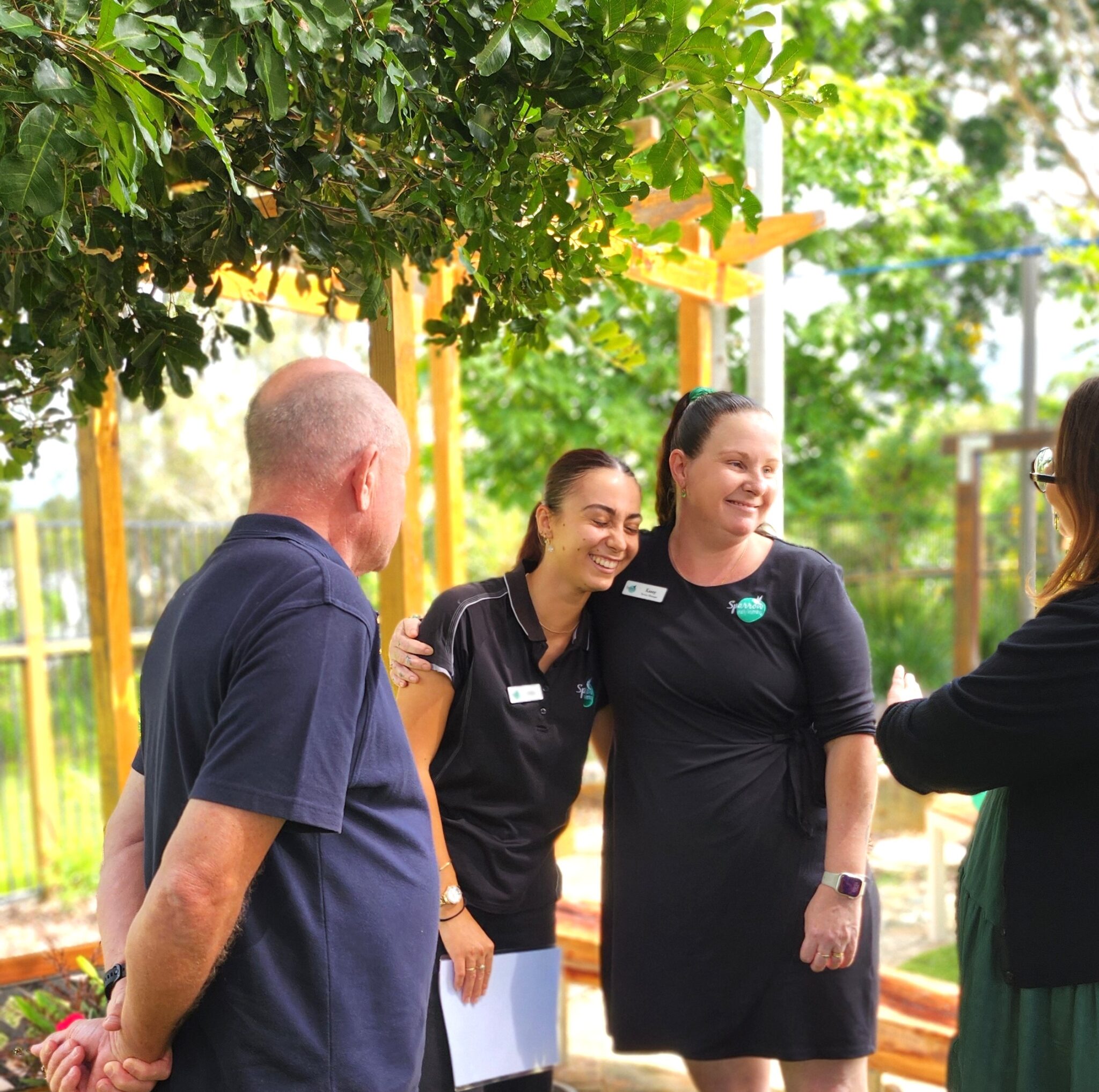 Sparrow Early Learning Seville Grove staff members enjoying a conversation outdoors