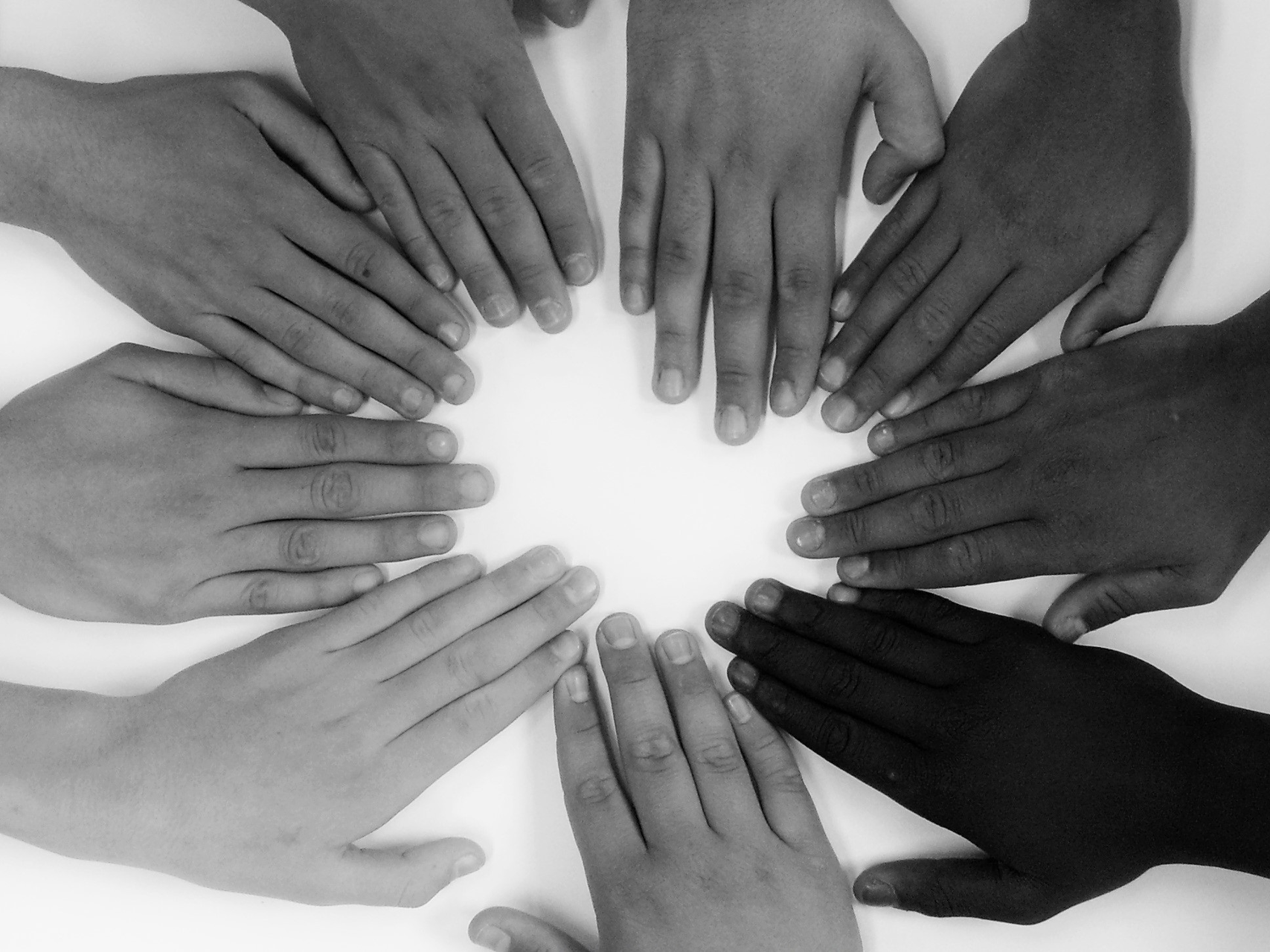 Children's hands together forming a circle