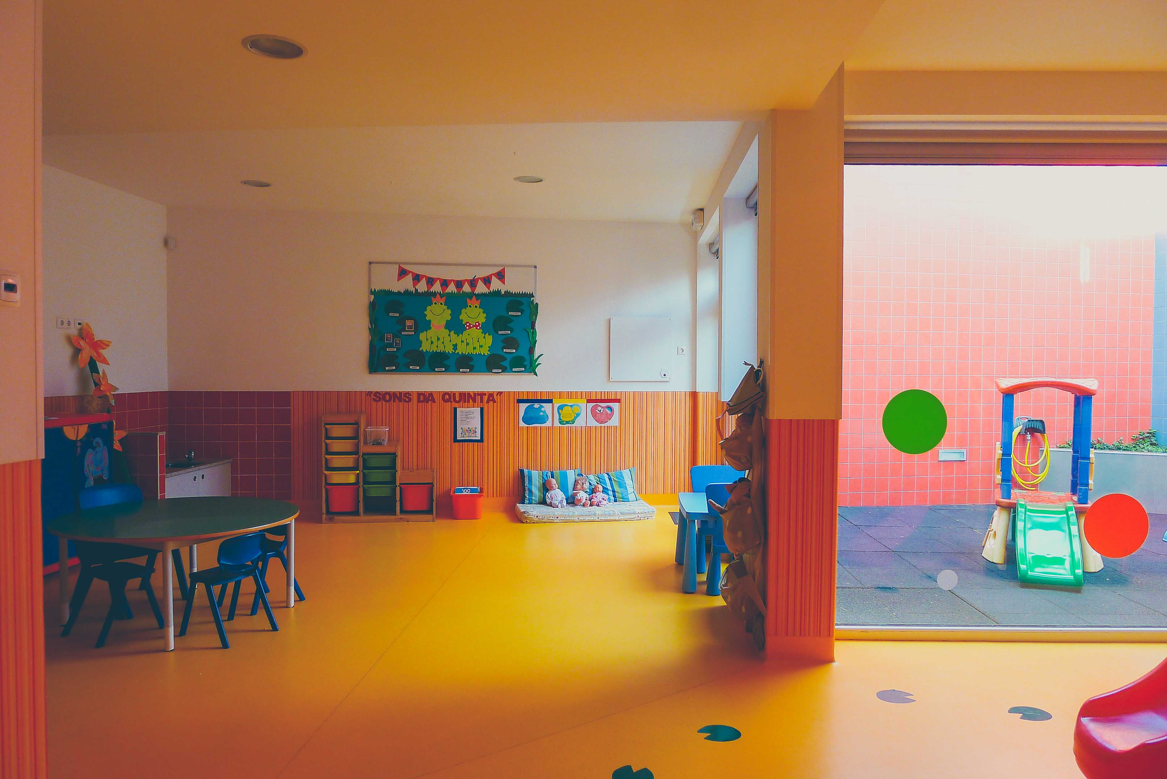 Preschool classroom with colorful furniture and toys