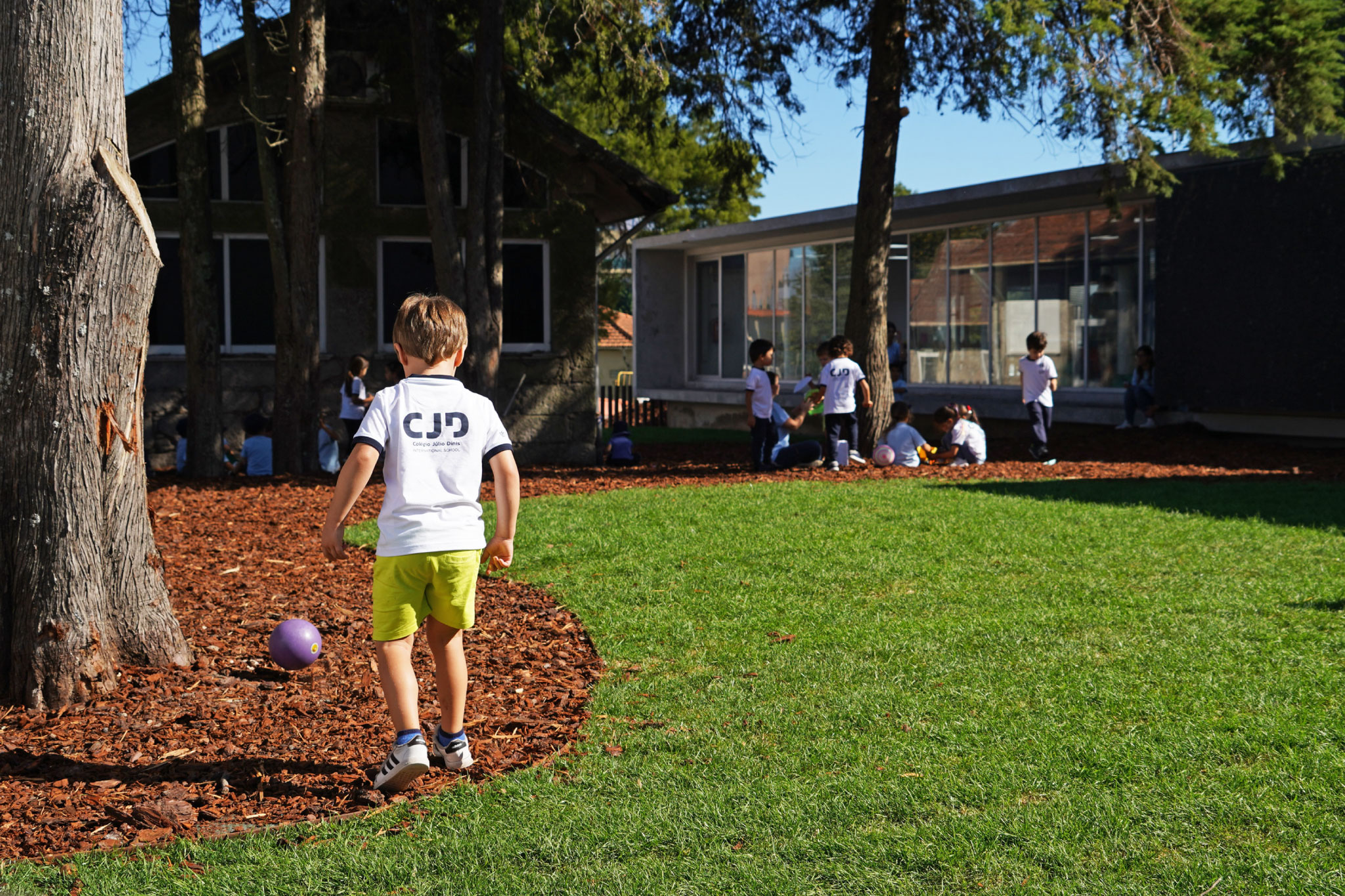 Preschool children playing outdoors at CJD International School