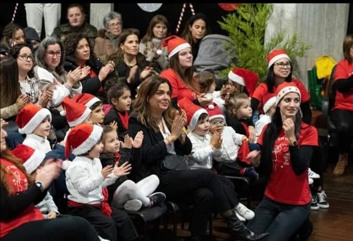 Preschool children and teachers celebrating Christmas