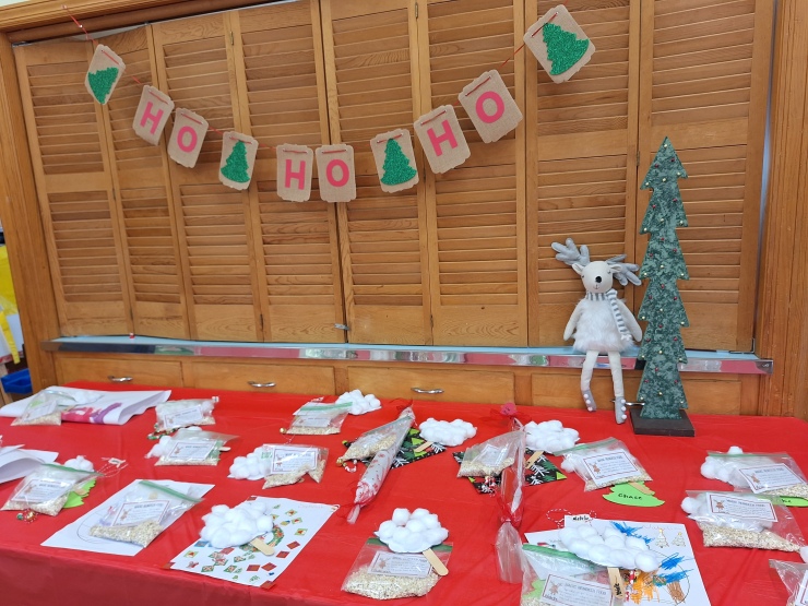 Preschool Christmas craft supplies arranged on a table