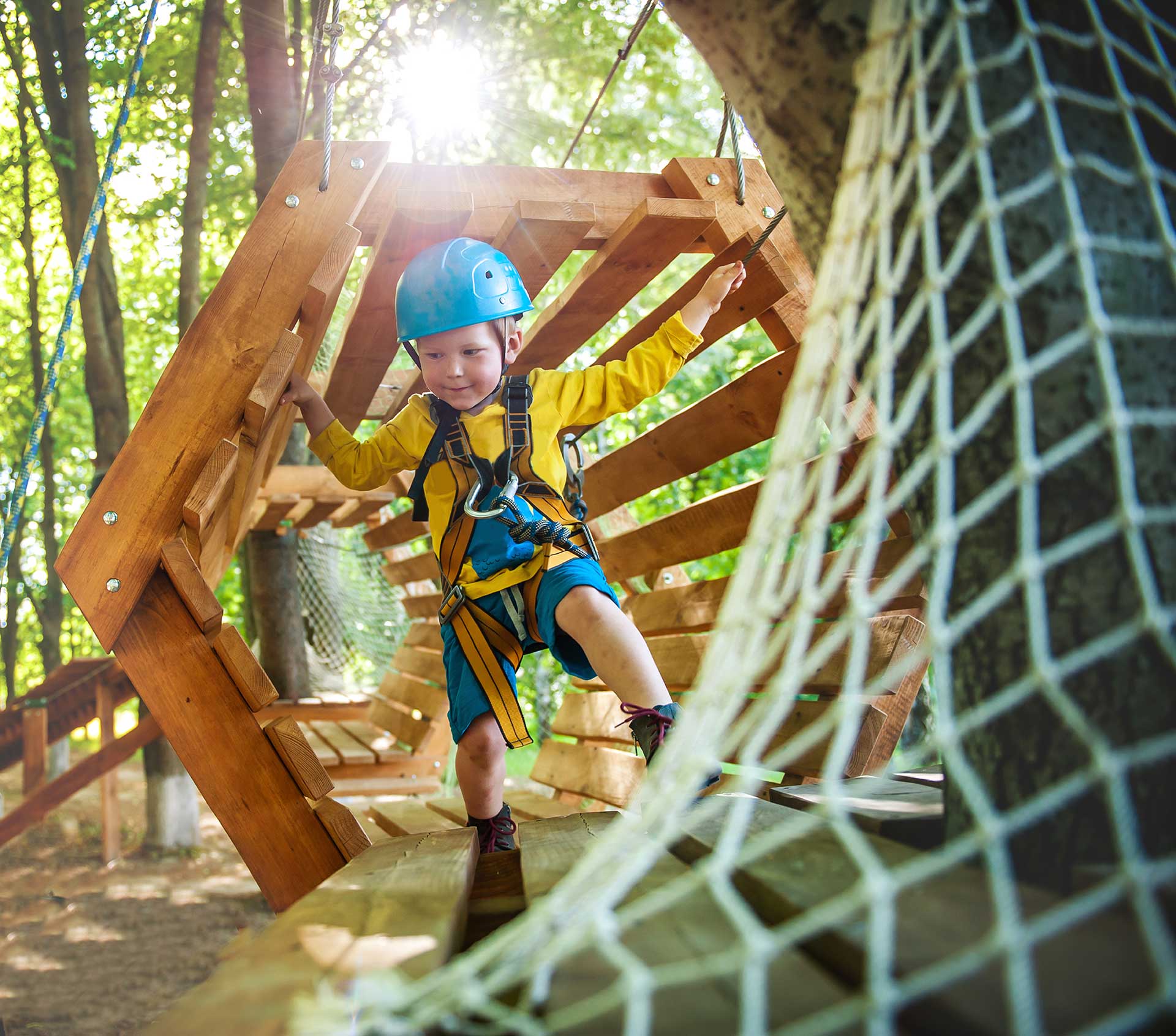 Preschool child on a playground obstacle course
