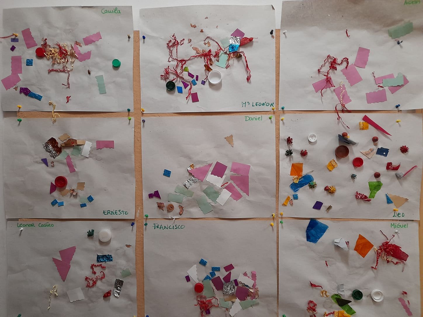 Preschool children's artwork displayed on a wall