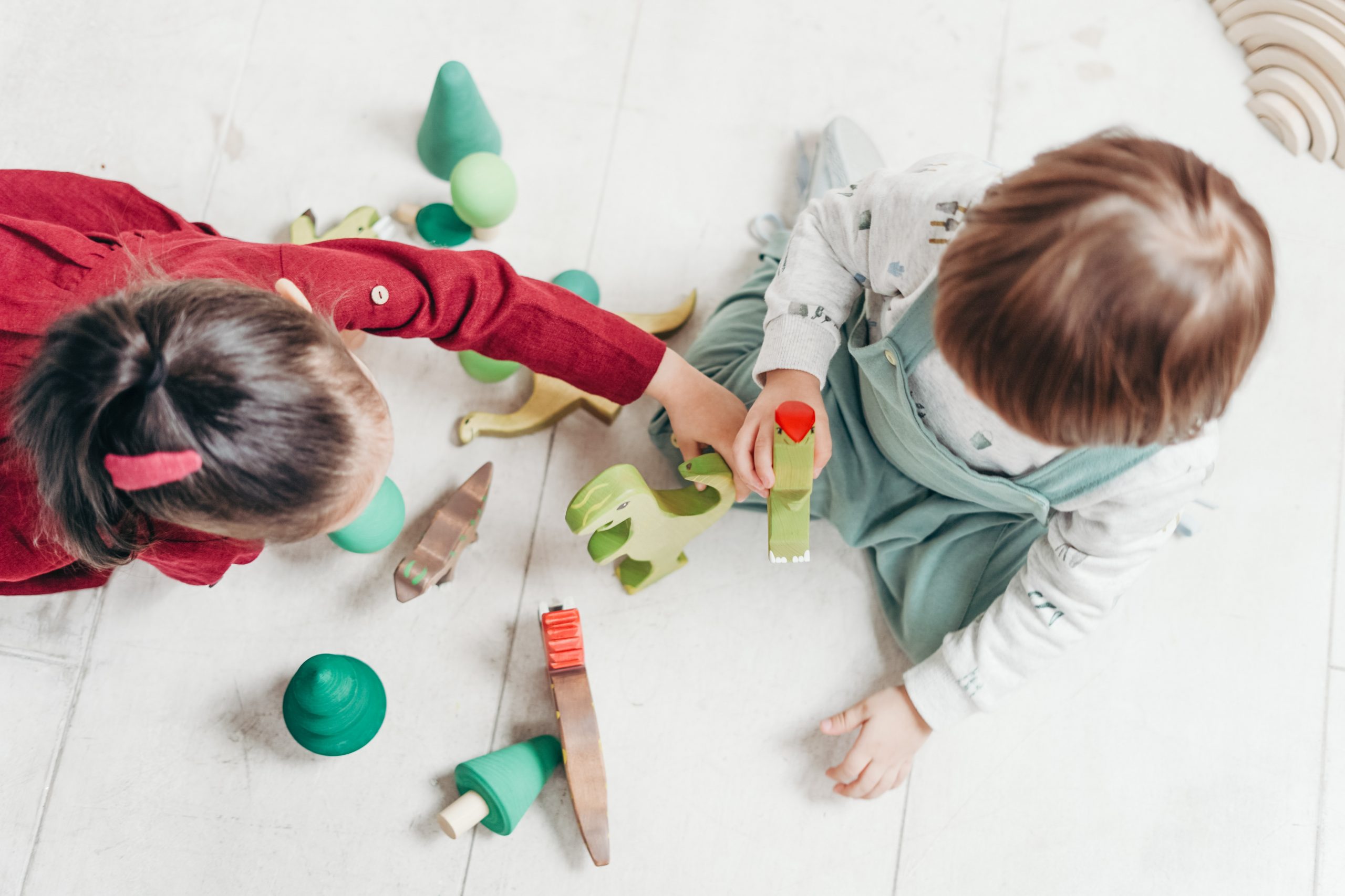 Preschool children playing with wooden toys