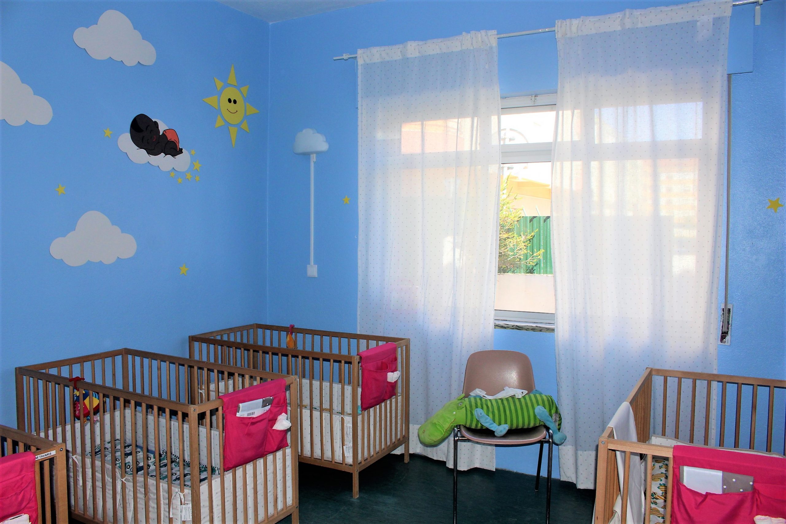 Preschool nursery with cribs and a playful design