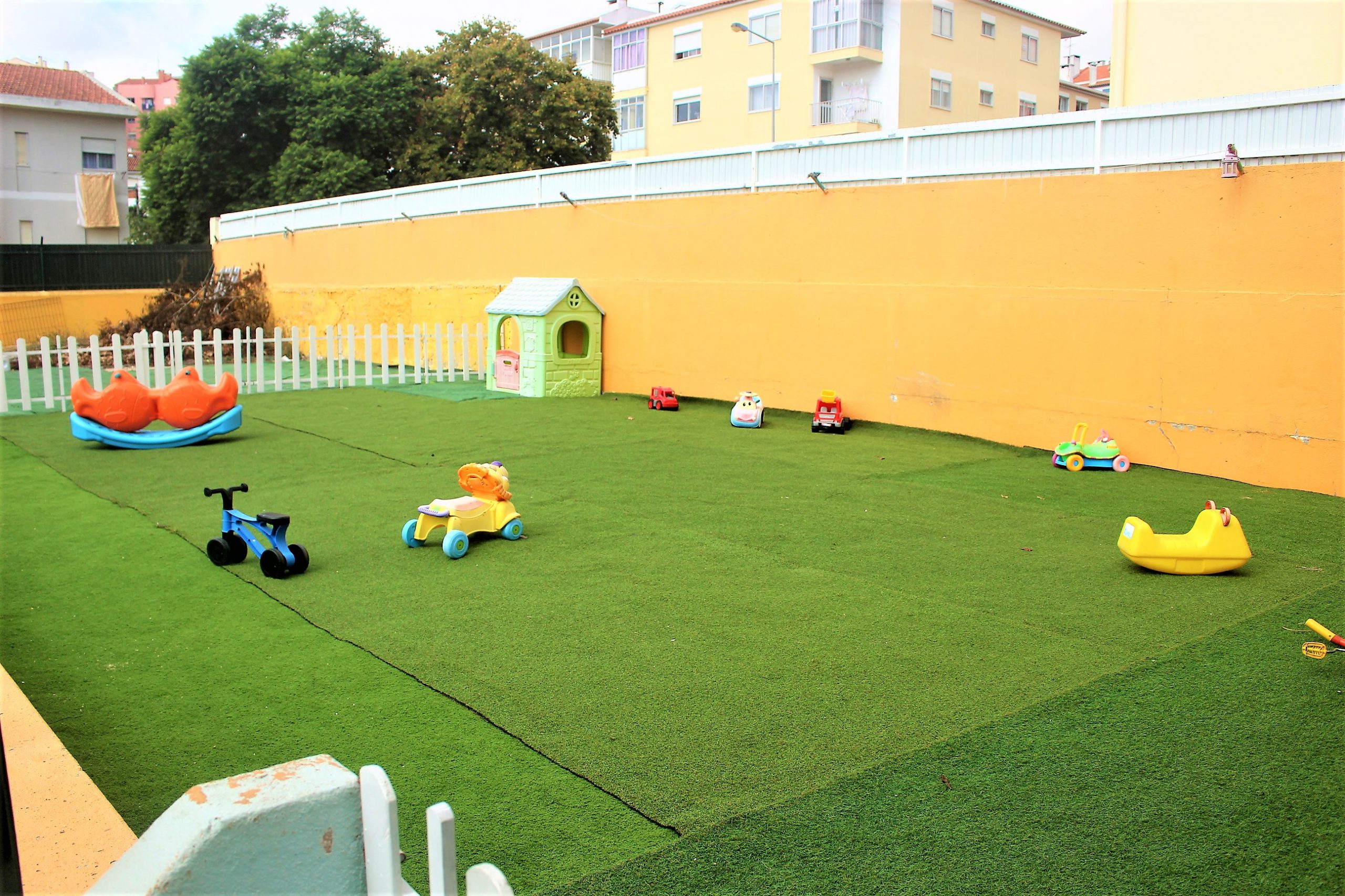 Preschool playground with toys and artificial turf