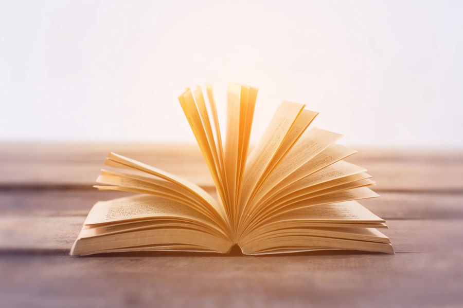 Open book on a wooden table