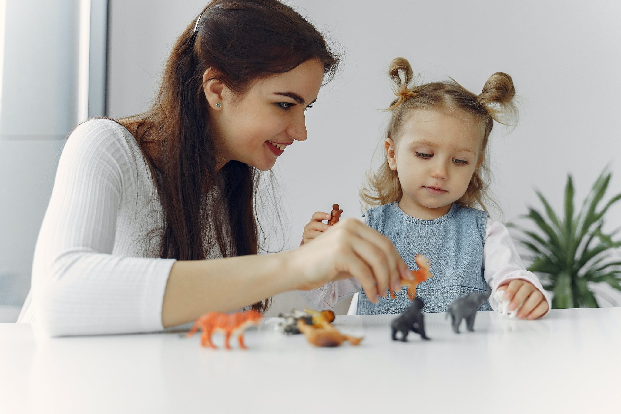 Teacher playing with a preschool child