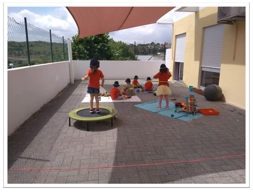 Preschool children playing outdoors at Parish Social Center of S. Brás
