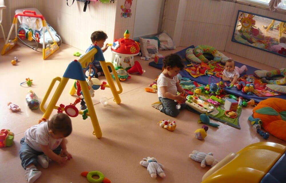 Preschool children playing with toys in a classroom