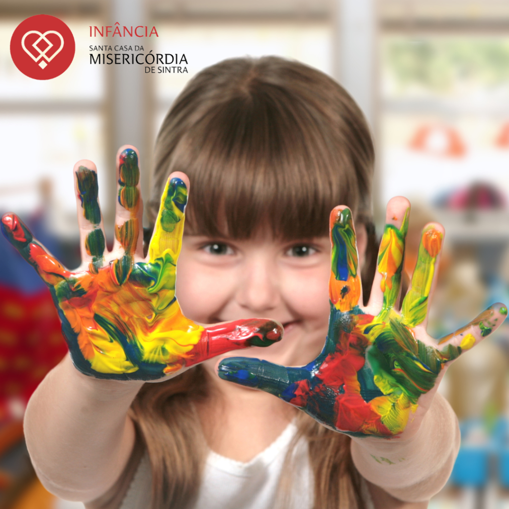 Preschool child with painted hands
