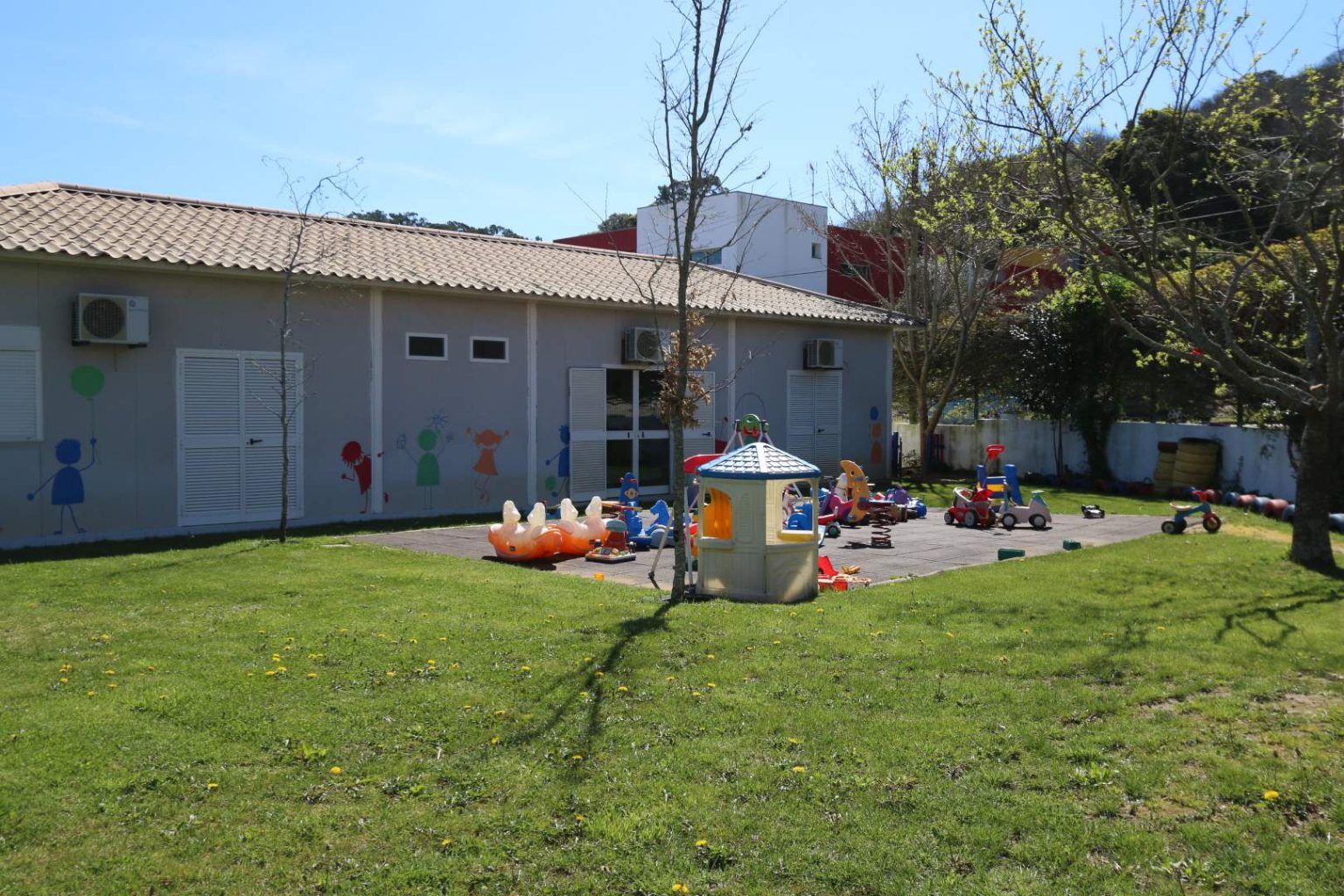 Preschool playground with colorful toys and play structures