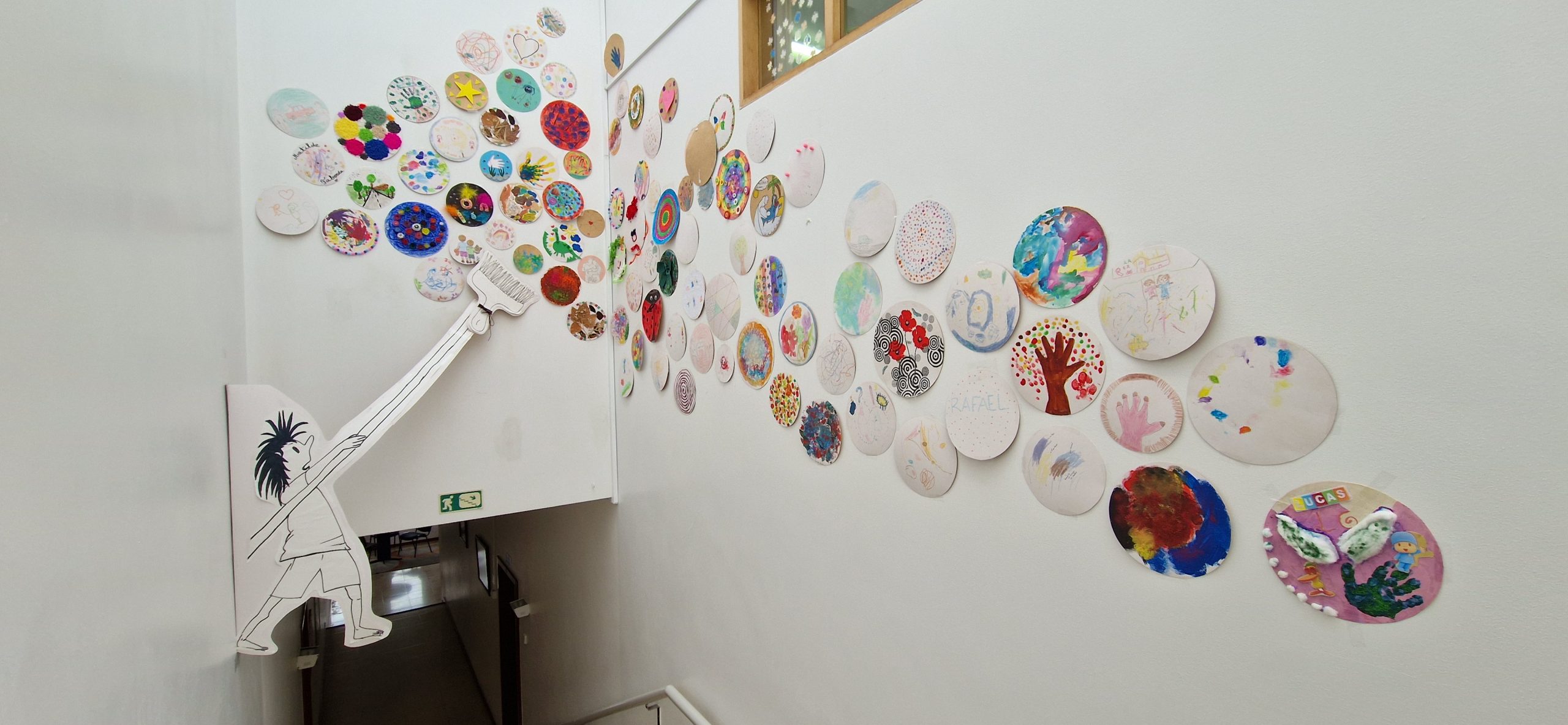 Colorful artwork created by preschool children adorns the walls of Infantário Popular de Sintra.