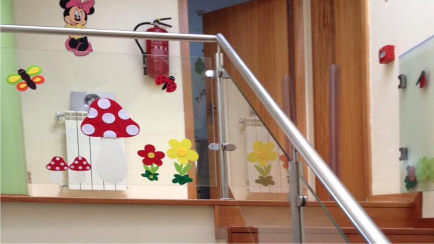 Preschool interior with colorful decorations on the glass wall