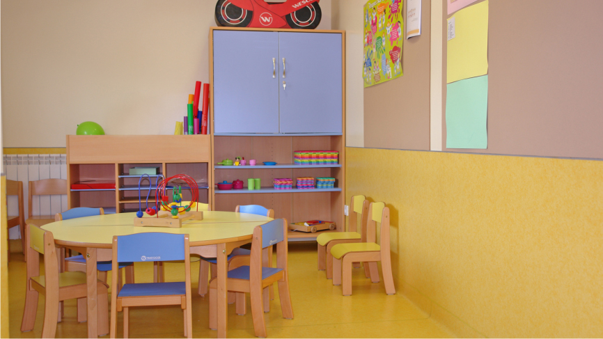 Preschool classroom with colorful furniture and toys