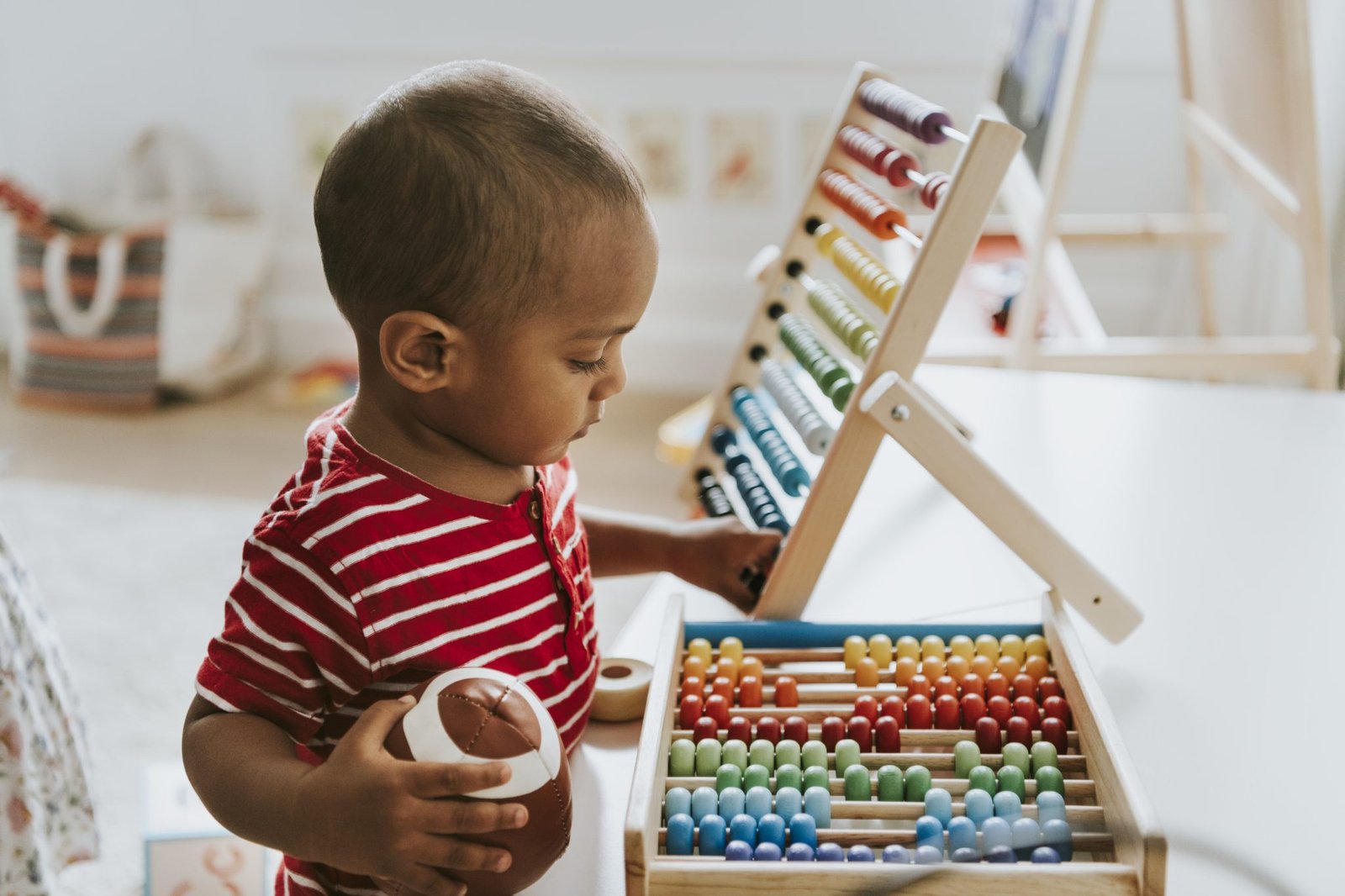Preschool child using colorful abacus