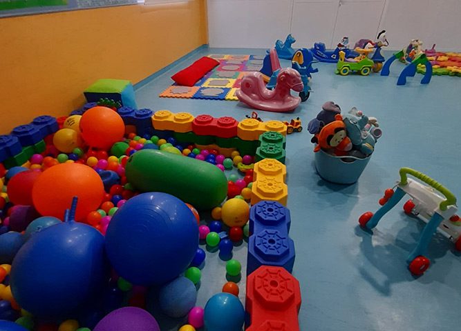Preschool playground with colorful toys and play structures