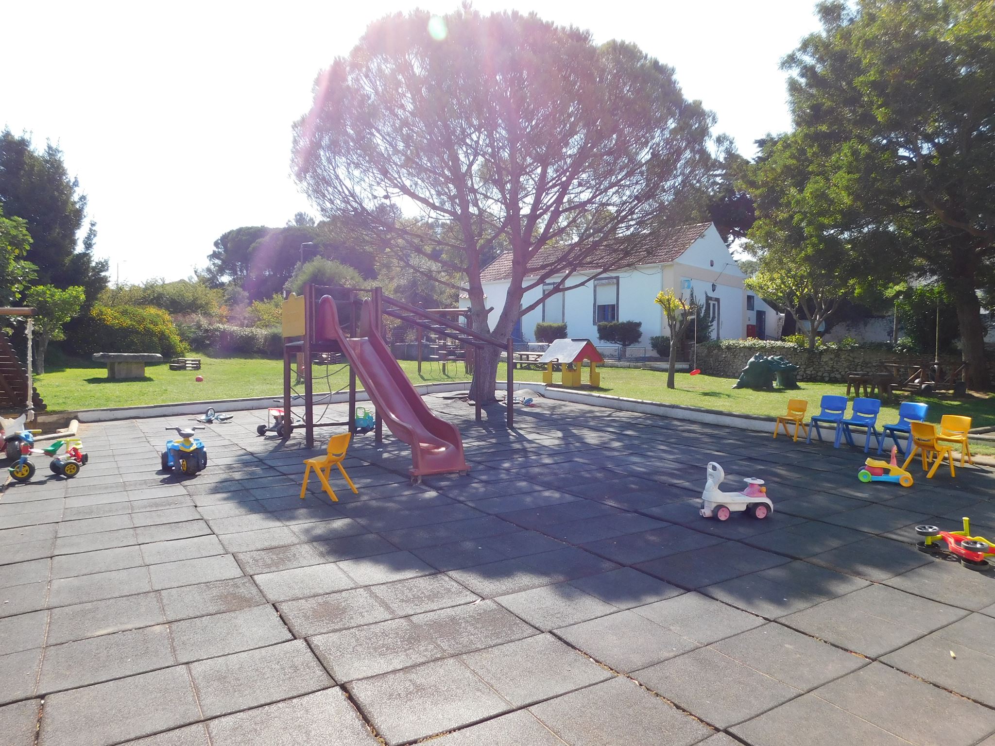 Preschool playground with slide and play equipment