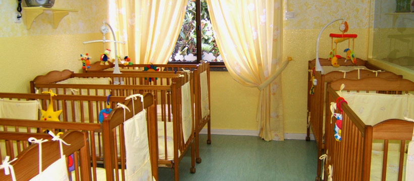 Infant cots in a nursery room