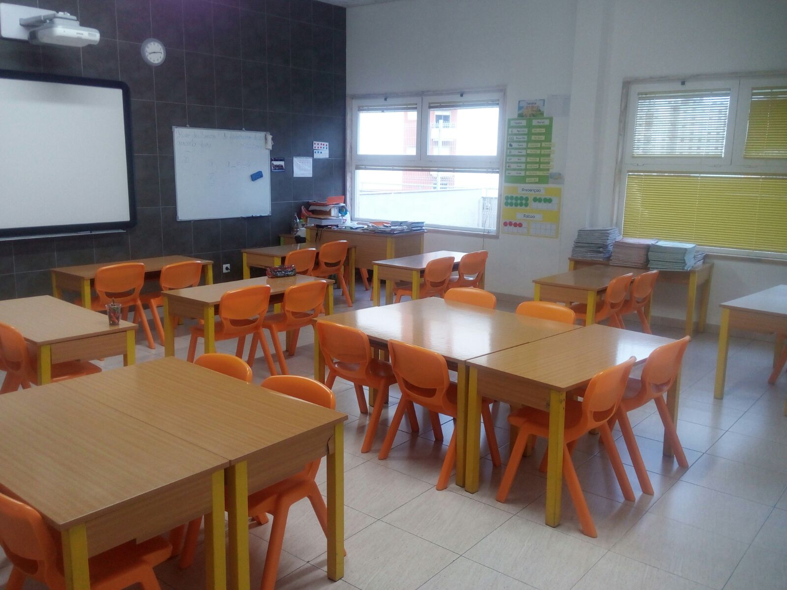 Preschool classroom with orange chairs and tables