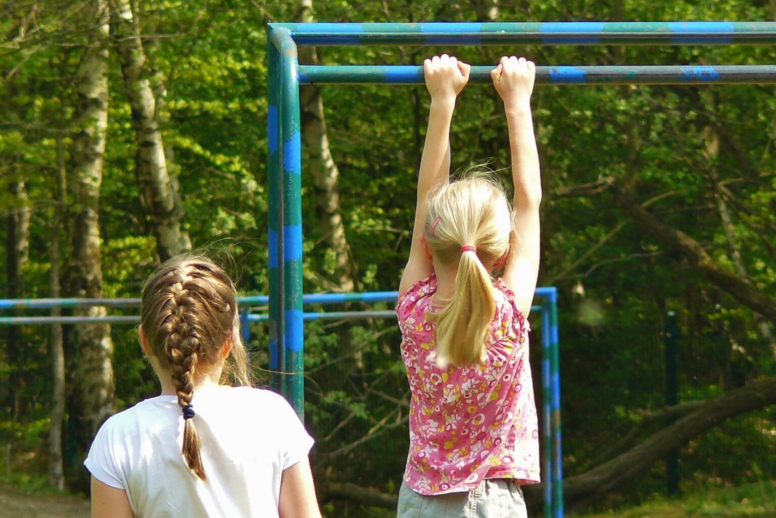 Two girls playing on a playground