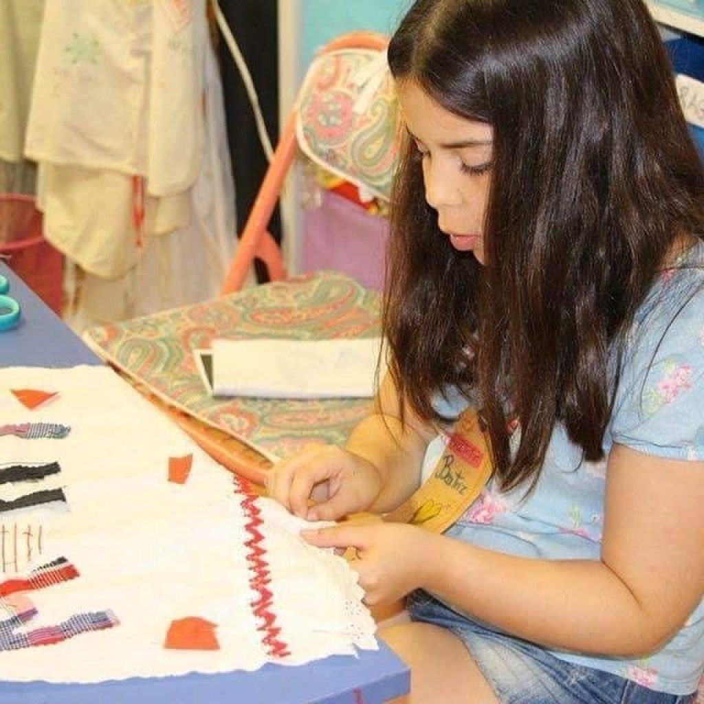 Preschool student focused on a handcraft project