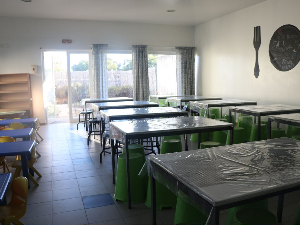 Preschool cafeteria with tables and chairs