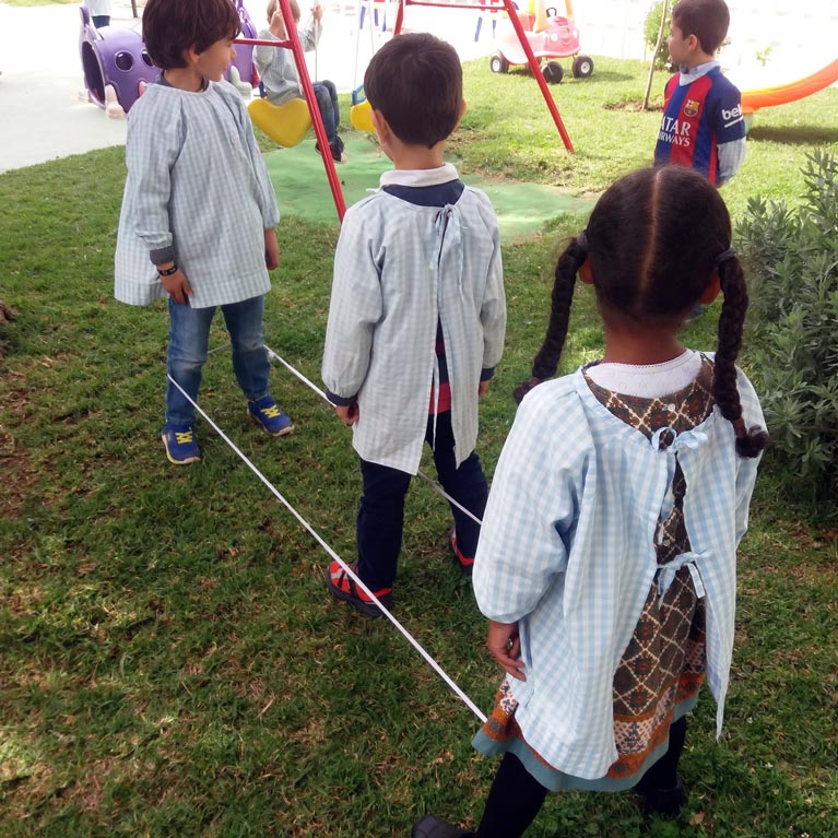 Preschool children playing a game outdoors