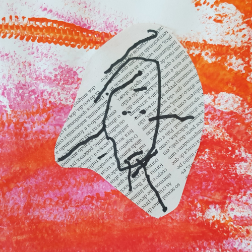 Preschool art project: child's drawing of a face on recycled paper with orange and pink paint background