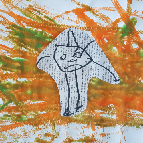 Preschool art project: child's drawing on newspaper background