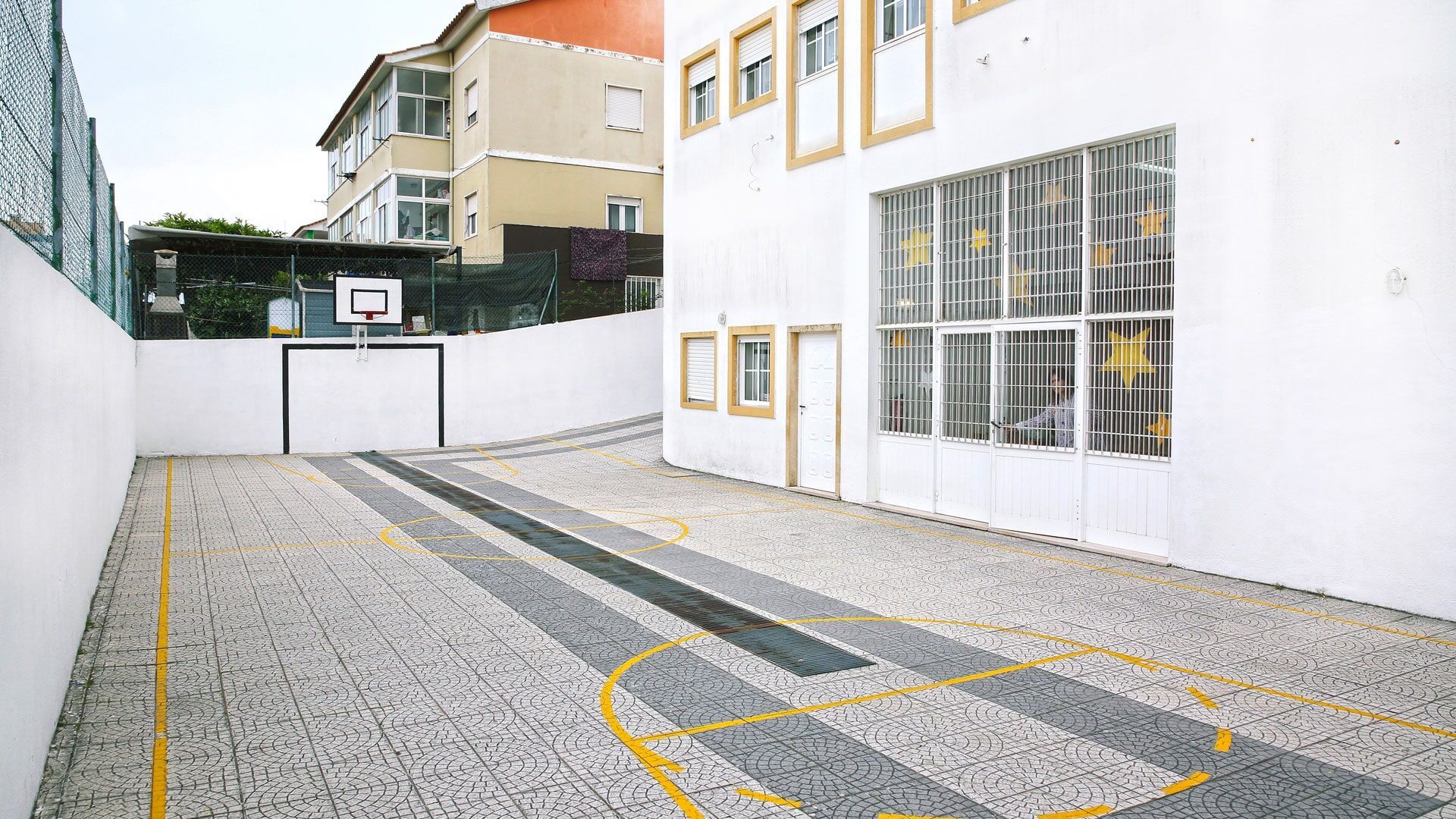 Externato Cinderela school playground with basketball hoop and soccer goal