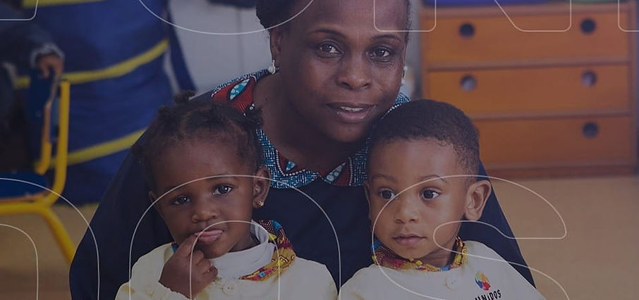 Teacher with two toddlers at Unidos preschool
